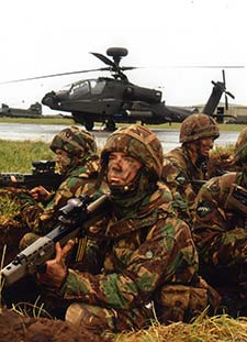 Troops in front of helicopter